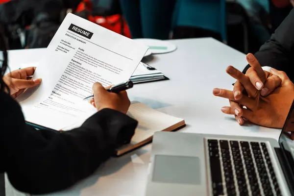 stock image Human resources department manager reads CV resume document of an employee candidate at interview room. Job application, recruit and labor hiring concept. uds