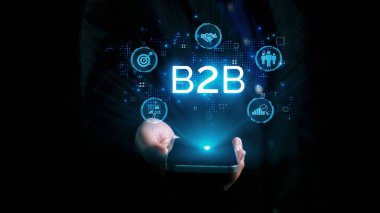 İş adamı B2B peyzajında geziniyor, iş-iş bağlantılarını geliştirmek için kullanım teknolojisi kullanıyor. B2B etkileşimini yeniden şekillendiren keşifler, iş-iş stratejilerinde yenilikleri yönlendiren araçlar. Kullanıcı Kimliği