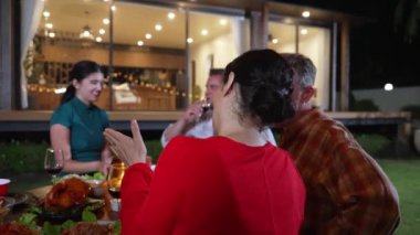 Family together for holiday celebration in garden. Family member gather have dinner. Outdoor picnic activity to relax with food and spend time with cute relatives cross generation gap. Divergence.