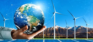 Alternatif enerji ile sürdürülebilirlik gelişimi kavramı. Çevre dostu rüzgar türbini çiftliği ve arka planda yeşil yenilenebilir enerji olan gezegenle insan eli ilgilenir. uds