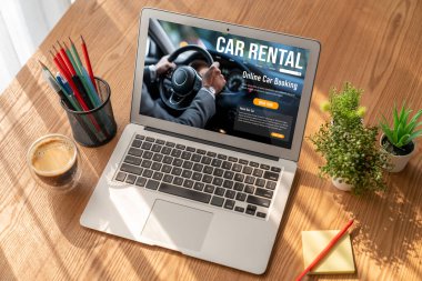 car rental website on computer screen for tourist to rent a car for transportation snugly