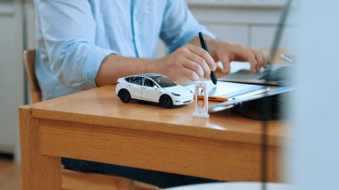 Car design engineer working on car prototype for automobile business at home office. Automotive engineering designer carefully analyze, finding flaws and improvement for car design. Synchronos clipart