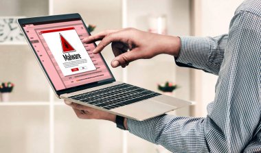 Cyber attacking concept. Malware alert showing on computer screen display scam and threat detection on computer system or online server to be removed snugly.