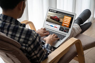 car rental website on computer screen for tourist to rent a car for transportation snugly