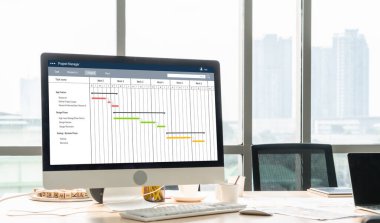 Ekip projesinin zaman çizelgesini gösteren bilgisayar ekranında, modern iş projesi yönetimi için proje planlama yazılımı