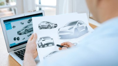 Car design engineer analyze car prototype for automobile business at home office. Automotive engineering designer carefully analyze, finding flaws and improvement for car design with laptop Synchronos clipart