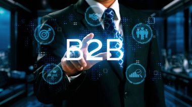 İş adamı B2B peyzajında geziniyor, iş-iş bağlantılarını geliştirmek için kullanım teknolojisi kullanıyor. B2B etkileşimini yeniden şekillendiren keşifler, iş-iş stratejilerinde yenilikleri yönlendiren araçlar. Kullanıcı Kimliği