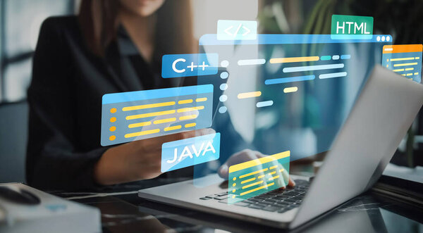 Software developer or programmer work with coding digital overlays of various programming languages like HTML, Python, Java, and C EIDE for new application mobile phone development