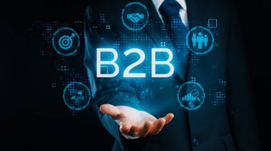 İş adamı B2B peyzajında geziniyor, iş-iş bağlantılarını geliştirmek için kullanım teknolojisi kullanıyor. B2B etkileşimini yeniden şekillendiren keşifler, iş-iş stratejilerinde yenilikleri yönlendiren araçlar. Kullanıcı Kimliği