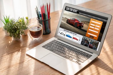 car rental website on computer screen for tourist to rent a car for transportation snugly