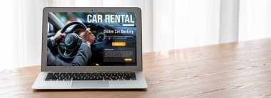 car rental website on computer screen for tourist to rent a car for transportation snugly