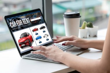 car rental website on computer screen for tourist to rent a car for transportation snugly