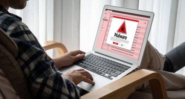 Cyber attacking concept. Malware alert showing on computer screen display scam and threat detection on computer system or online server to be removed snugly.