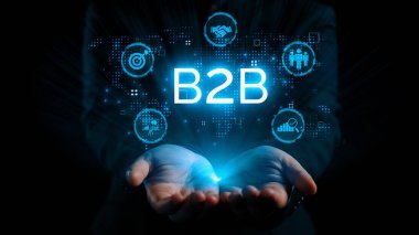 İş adamı B2B peyzajında geziniyor, iş-iş bağlantılarını geliştirmek için kullanım teknolojisi kullanıyor. B2B etkileşimini yeniden şekillendiren keşifler, iş-iş stratejilerinde yenilikleri yönlendiren araçlar. Kullanıcı Kimliği