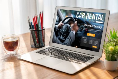car rental website on computer screen for tourist to rent a car for transportation snugly