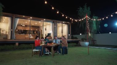 Family together for holiday celebration in garden. Family member gather have dinner. Outdoor picnic activity to relax with food and spend time with cute relatives cross generation gap. Divergence.