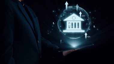 İş adamı online bankacılığı dönüştürüyor, yenilikçi finans çözümleri için teknoloji çalıştırıyor. Bankacılık ve finans süreçlerini düzene sokan Teknoloji, online bankacılığı yeni seviyelere yükseltiyor. Kullanıcı Kimliği