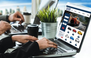 car rental website on computer screen for tourist to rent a car for transportation snugly