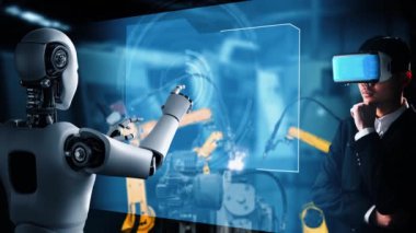 Cybernated industry robot and human worker working together in future factory . Concept of artificial intelligence for industrial revolution and automation manufacturing process .
