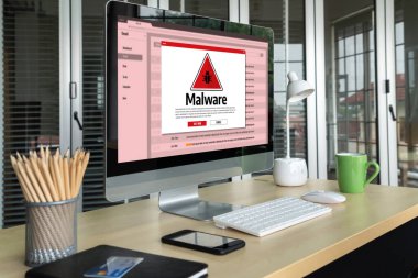 Cyber attacking concept. Malware alert showing on computer screen display scam and threat detection on computer system or online server to be removed snugly.