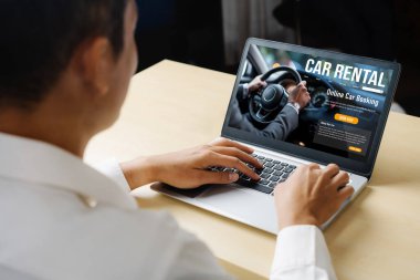 car rental website on computer screen for tourist to rent a car for transportation snugly