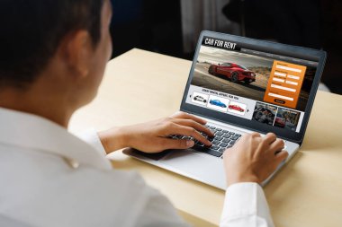 car rental website on computer screen for tourist to rent a car for transportation snugly