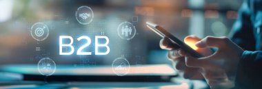 İş adamı B2B peyzajında geziniyor, iş-iş bağlantılarını geliştirmek için kullanım teknolojisi kullanıyor. B2B etkileşimlerini yeniden şekillendirir, iş stratejilerindeki yenilikleri tetikler. EIDE