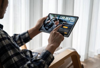 car rental website on computer screen for tourist to rent a car for transportation snugly