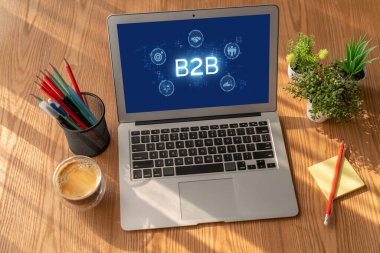 İş adamı B2B peyzajında geziniyor, iş-iş bağlantılarını geliştirmek için kullanım teknolojisi kullanıyor. B2B etkileşimini yeniden şekillendiren keşifler, iş-iş stratejilerinde yenilikleri yönlendiren araçlar. canlı