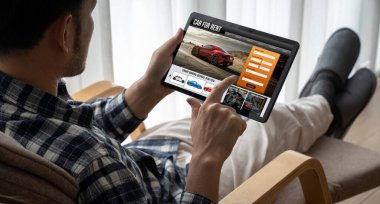 car rental website on computer screen for tourist to rent a car for transportation snugly