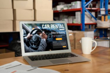 car rental website on computer screen for tourist to rent a car for transportation snugly