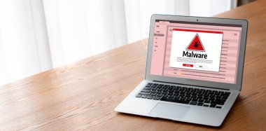 Cyber attacking concept. Malware alert showing on computer screen display scam and threat detection on computer system or online server to be removed snugly.