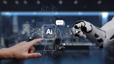 Bir insan eli, günlük hayatta yapay zeka ve teknolojinin kusursuz bütünlüğünü gösteren, gösterişli ve modern bir ofiste robotik bir kolla etkileşime girer. Auvana