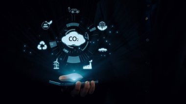 İş adamı CO2 emisyonlarını azaltmak için girişimlerde bulunuyor ve net sıfır hedefliyor. Daha yeşil bir gezegenin karbondioksitini azaltarak sürdürülebilirliğe olan bağlılığını gösteriyor. Kullanıcı Kimliği