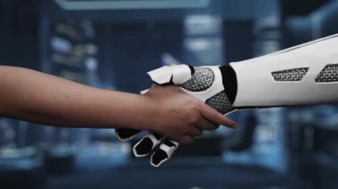 Bir insan ve robotik kol arasındaki tokalaşmayı tasvir eden yakın plan bir video, gelecekçi dijital fon ortasındaki pazarlama stratejisinde işbirliğini sembolize ediyor. Auvana