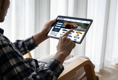 car rental website on computer screen for tourist to rent a car for transportation snugly