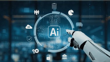 Robotik bir el, modern iş ortamlarında teknolojinin ve yenilikçi çözümlerin entegrasyonunu vurgulayan gelecekteki bir ofisteki yapay zeka arayüzüne işaret ediyor. Auvana