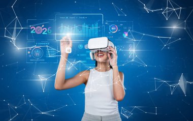 Bir kadın, 2026 yılı yapay zeka ve veri analizlerinin yol açtığı yenilikçi pazarlama stratejilerini keşfetmek için sanal gerçeklik kulaklığı kullanıyor. XDMCP