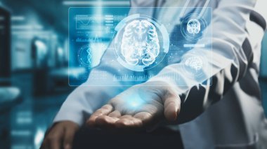 Yetenekli doktorların oturduğu ve elinde beyin anatomisi hologramı olan hastaların yakınından geç. Tıbbi çalışanlar, tıbbi verileri kullanarak beyin hastalıklarını inceleyip analiz ediyorlar. Teknoloji. İyileştirici.