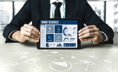 Human resources management software on computer screen helping human resources employee to manage recruitment, payroll, staff searching and KPI evaluation snugly