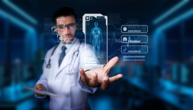 Bir tıp uzmanı, insan anatomisi ve sağlık ölçümlerini göstermek için artırılmış gerçeklikle uğraşır. Yüksek teknoloji, yenilikçi sağlık hizmetleri uygulamalarını ön plana çıkarıyor. PHMT