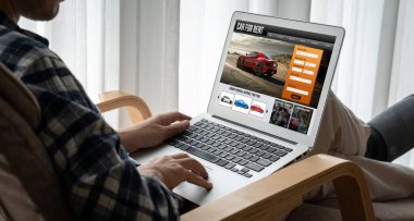 car rental website on computer screen for tourist to rent a car for transportation snugly