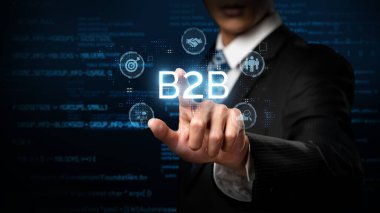 İş adamı B2B peyzajında geziniyor, iş-iş bağlantılarını geliştirmek için kullanım teknolojisi kullanıyor. B2B etkileşimlerini yeniden şekillendirir, iş-iş stratejilerinde yenilikleri teşvik eder. FaaS