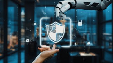Robotik bir el, bir insana siber güvenlik korumasında yardım etmek için uzanıyor ve teknolojinin gelişmiş güvenlik çözümleri için modern bir ofis ortamına entegrasyonunu gösteriyor. Auvana