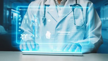 İnsan vücudunun anatomisi hologramıyla klavyede yazan zeki doktorlara yaklaş. Sağlık çalışanı, teknolojiyi kullanarak HUD gösterge paneline bakarken semptomları araştırıyor ve teşhis ediyor. İyileştirici.