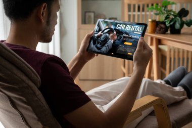car rental website on computer screen for tourist to rent a car for transportation snugly