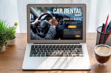car rental website on computer screen for tourist to rent a car for transportation snugly
