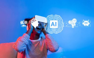 Genç bir insan, canlı mavi ışık ve yapay zeka ve teknoloji kavramlarının grafiksel temsilleriyle çevrili bir sanal gerçeklik kulaklığıyla neşeyle meşgul oluyor. XDMCP