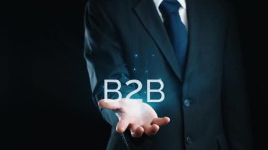 İş adamı B2B peyzajında geziniyor, iş-iş bağlantılarını geliştirmek için kullanım teknolojisi kullanıyor. B2B etkileşimini yeniden şekillendiren keşifler, iş-iş stratejilerinde yenilikleri yönlendiren araçlar. Kullanıcı Kimliği