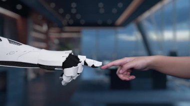 Teknoloji ve yeniliğin karışımını sembolize eden sistem güncellemesi devam ederken, eşsiz bir etkileşimde bir robot el ve bir insan parmağı tasvir eden büyüleyici bir video. Auvana